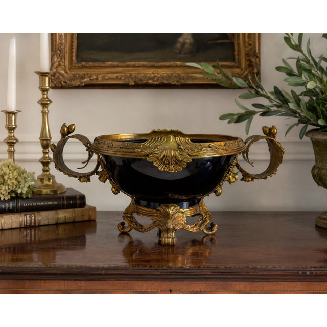 Richly appointed in deep cobalt porcelain and framed by finely cast ormolu mounts, this impressive French Sèvres style...