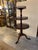 Antique Circa 1800-1820 solid mahogany three tiered dumb water table. The round tops with hand carved urn form rungs along...