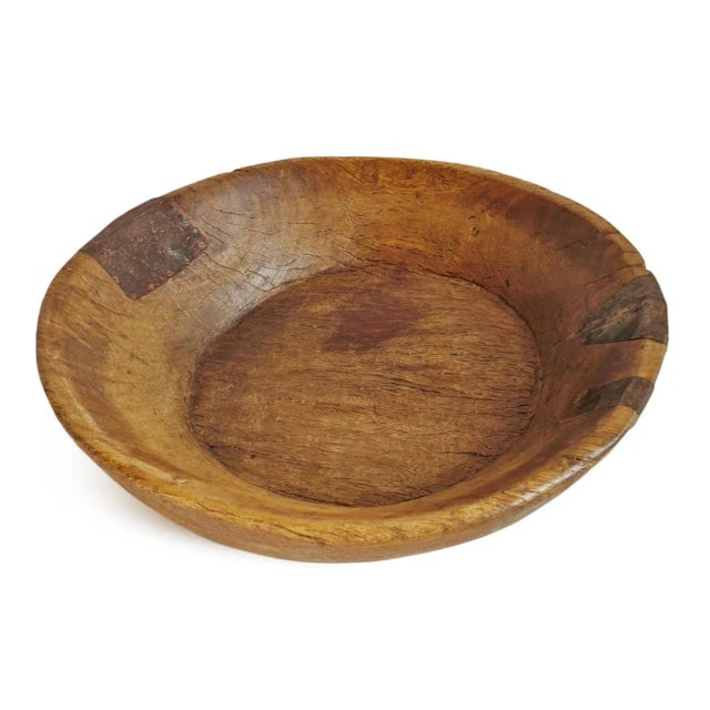 Vintage teak wood bowl from India. Original aged finish and metal detail.