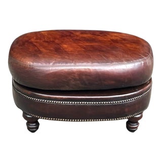 Vintage Oval Brown Leather Ottoman With Brass Nailhead Trim and Carved Wood Feet For Sale