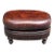 Vintage Oval Brown Leather Ottoman With Brass Nailhead Trim and Carved Wood Feet For Sale