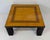 Coffee table from the 1980s, crafted in ash burl with refined inlay in various wood essences, glossy black lacquer and...
