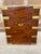 A 19th century English Mahogany box with brass strap work, flush side handles, and a divided green lined interior holding...