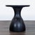 Inspired by the rounded, gourd-shaped tribal drums found throughout Africa, the table is crafted from blackened wood. It...