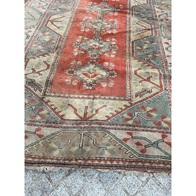 Mid century Turkish rug with a geometrical design and light colours, entirely hand knotted with wool on wool foundation...