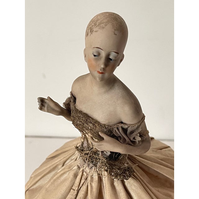 19 th c antique French silk doll with porcelain top lamp shade.