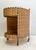 Here a typical 1960s mobile serving trolley, made of wood and woven rattan-wicker, with a black metal handle and brass...