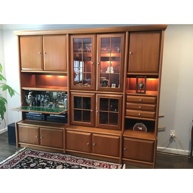 Genuine teak construction with beautiful natural wood grain. Large and versatile design Built in bar area with glass...