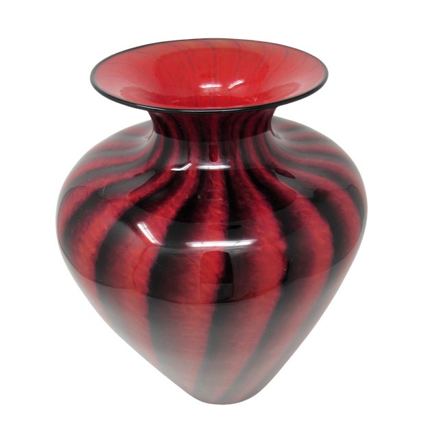 An elegant red and black art glass shoulder vase by US glass artist Lisa Aronzon. The vertical bands of black on the red...