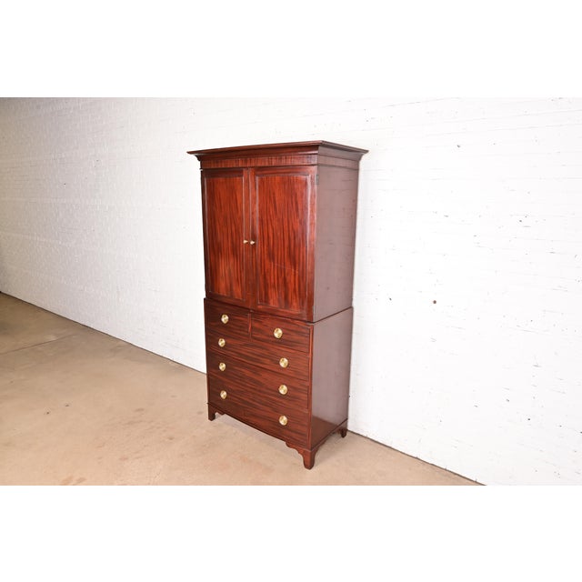 A gorgeous Federal or Hepplewhite style armoire dresser, gentleman's chest, or linen press By Baker Furniture USA, Late...
