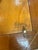 An Italian picture frame by Aurora, with a wide, mitered border in richly figured dark brown wood. Its warm finish and...