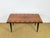 An elegant art deco table from the 1940s, featuring superb herringbone marquetry in the center of the tabletop. this...