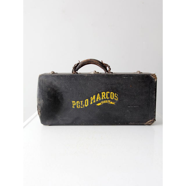 This is a 1940s Holton Collegiate silver-plate trumpet. Featuring its original case emblazoned with the Polo, IL "Polo...