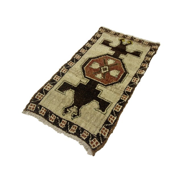 Vintage Handknotted decorative mini rug from Kars region of Turkey. Approximately 45-55 years old. In very good condition.