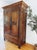 This 1867 French oak armoire is a stunning example of 19th-century craftsmanship, hand-carved with remarkable detail that...
