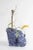Medium sodalite flower vessel by studio do dimensions: d 23 x w 16 x h 24 cm materials: sodalite, brass. 15 kg. flowers...