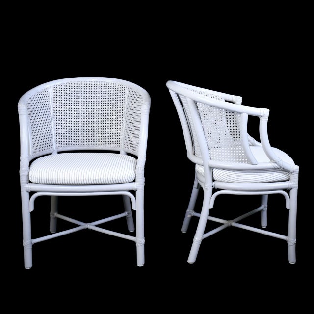 Elevate your dining space with this exceptional set of 8 rattan and cane dining chairs, crafted under the Hans Kaufeld...
