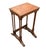 An elegant pair of English Regency Revival nesting tables, c. 1900-1930 and distinguished by beautifully figured burl...