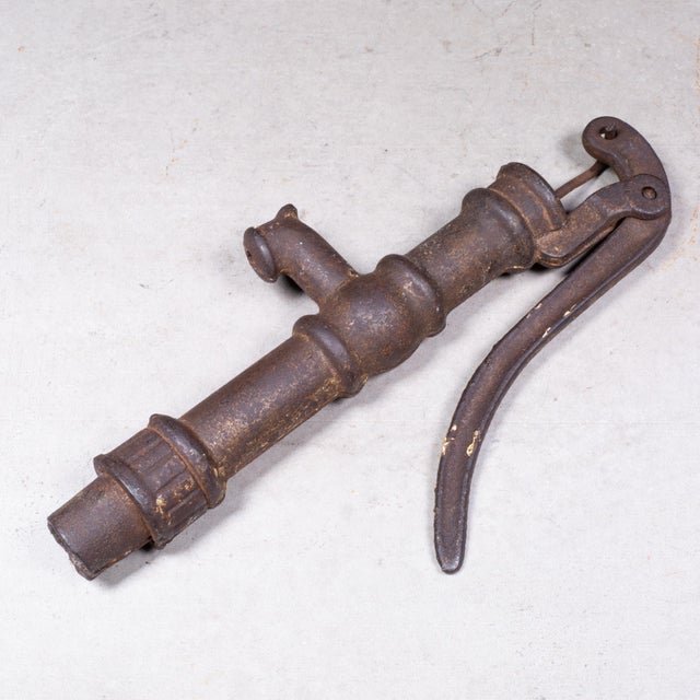 ABOUT Antique miniature cast iron hand water pump dating back to the late 19th or early 20th century. Given its small...