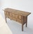 This 19th century console table, made from polarwood, features a 5 drawer configuration with 3 small upper drawers over 2...