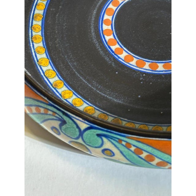 This Dutch Art Deco Gouda bowl by Zuid-Holland, made in the Netherlands in 1922, is decorated in the Rialto pattern and...