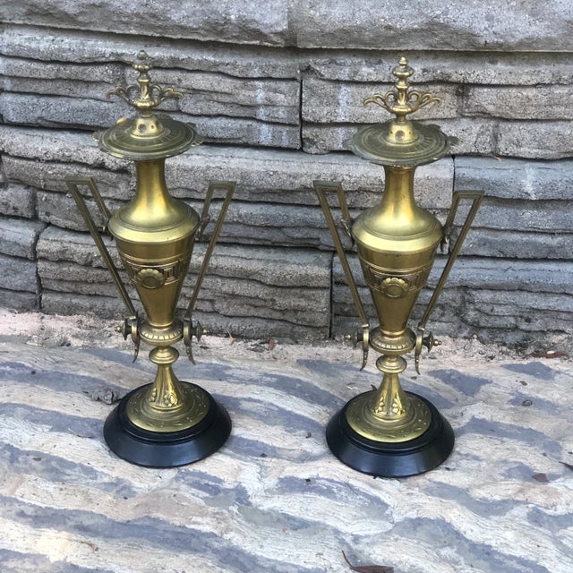 Pair of late 19th to early 20th Century Bronze Dore Etruscan Urns on black marble bases. Perfect for your mantle or to add...