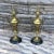 Pair of late 19th to early 20th Century Bronze Dore Etruscan Urns on black marble bases. Perfect for your mantle or to add...