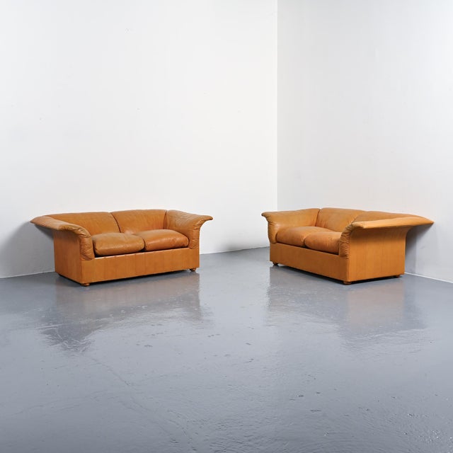 Pair of model 973 sofas, known as the Loto, designed by Luigi Massoni for Poltrona Frau in Italy in 1976. Fully...