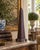 A beautifully proportioned rust color metal obelisk. The sculptural silhouette and pattern detail give the piece a quietly...