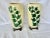 Beautiful pair of vintage vases. Made by Royal Copley. Feature ivy detailing on the front. The background is a warm...