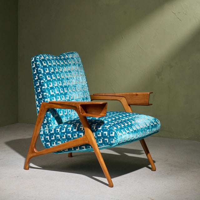 Designed by Augusto Romano during the 1940s, this lounge chair has a natural blonde European Walnut wood frame and is...