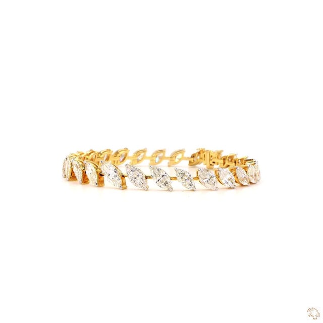 This line bracelet from our contemporary estate collection centers on a 14.0-carat diamond in an elongated marquise cut....