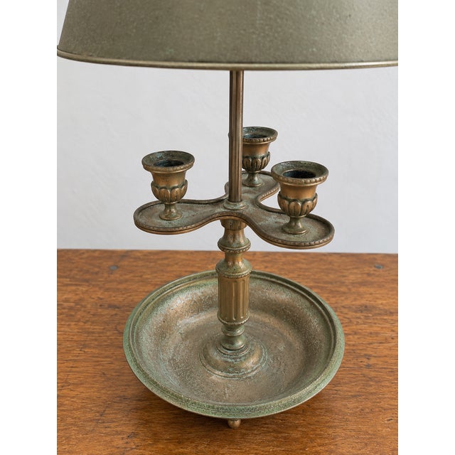 Vintage pewter-tone bouillotte style table lamp with an aged naturally patinated finish. Features three decorative candle...