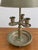 Vintage pewter-tone bouillotte style table lamp with an aged naturally patinated finish. Features three decorative candle...