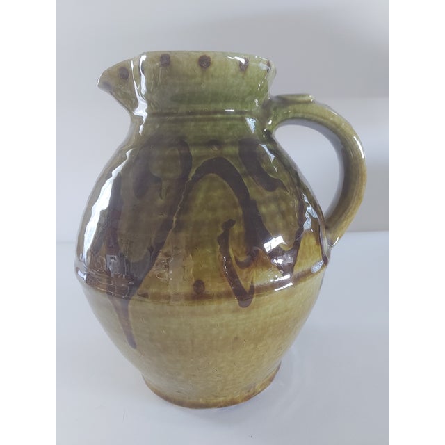 This is a Japanese pottery pitcher made in the style of work from Mashiko Village in Japan. The potters' early Buddhist...