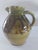This is a Japanese pottery pitcher made in the style of work from Mashiko Village in Japan. The potters' early Buddhist...