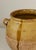 19th Century French Provincial confit pot with pulled handles. Ochre yellow glazed upper half, unglazed terracotta lower...