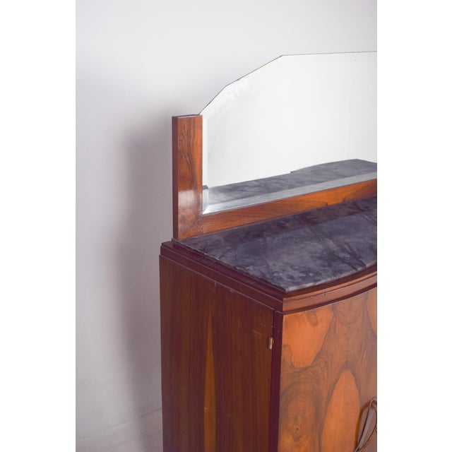 This Art Deco mirror sideboard is made of wood with beautiful natural grain, displayed in symmetrical patterns on the...