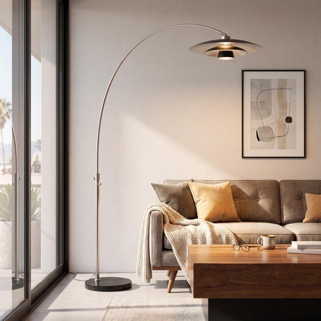 The Float Arc Lamp is a modern arc lamp with a Satin Nickel steel body and a Black Marble base, designed to be a statement...