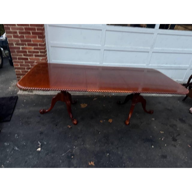 Vintage chippendale style double pedestal dining table, rope-edge banded inlaid dining table with 2 leaves. Well carved,...