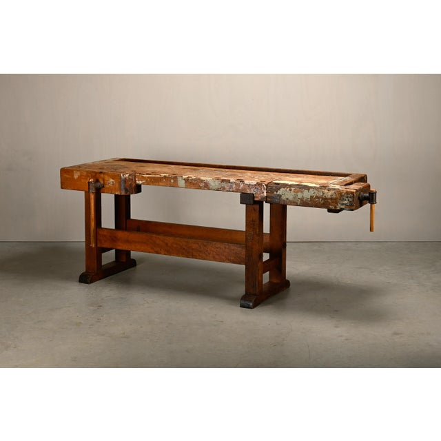 Vintage wooden carpenter's workbench, Europe, 1950s. This industrial workbench features a conventional layout with a...