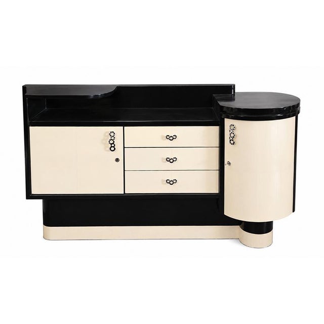 An elegant art deco sideboard with refined lines and an unmistakable 1930s charm, featuring a sophisticated natural...
