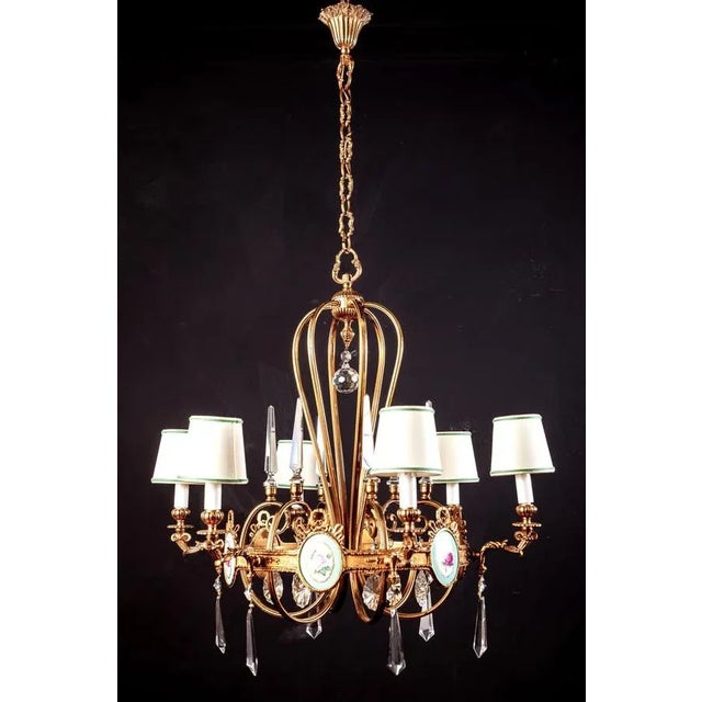 Wonderful six arm Art Deco brass chandelier with fine quality cut crystal pendants adorned with six amazing porcelain...