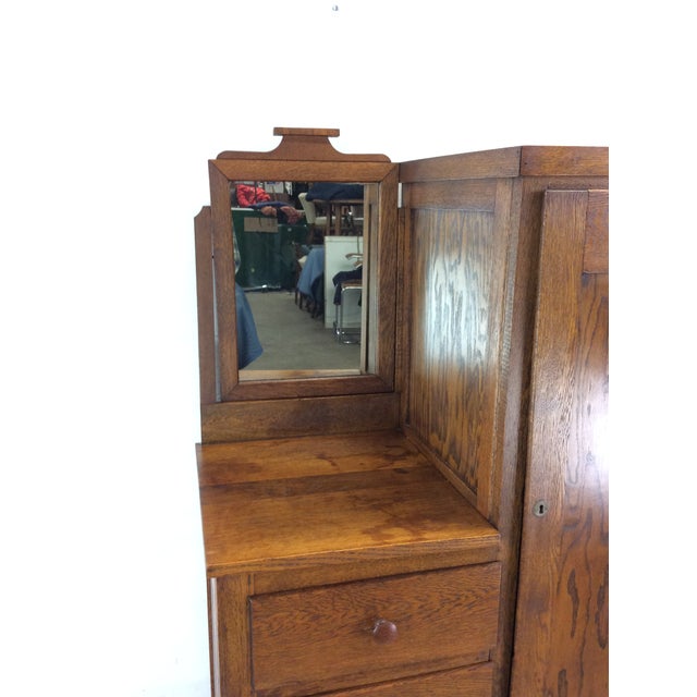 This antique side by side features four drawers with carved wood pull, large cabinet with expanding rack for hanging...