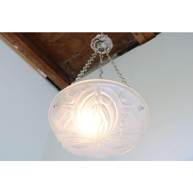Exquisite & Timeless! This stunning Geometric Art Deco light attributed to Henry Mouynet from France 1930. The quality of...