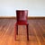 Set of four dark red leather chairs with a metal frame. Made in Italy by Frag. An elegant and timeless design. Similar in...