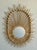 Elevate your living space with this captivating vintage Boho Rattan Sunburst Mirror. Crafted with an eye for natural...