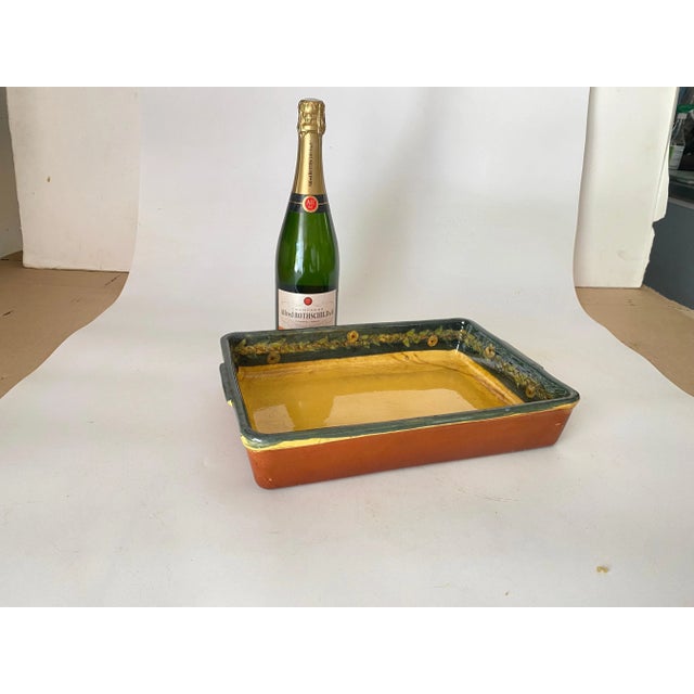 This is a Earthenware dish that goes to the oven. It has been done in France circa 1960. Yellow and Brown color.