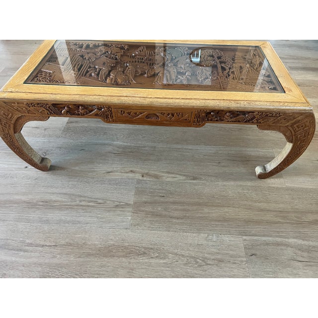 Elevate your living space with this exquisite George Zee hand-carved coffee table, a true statement piece that combines...