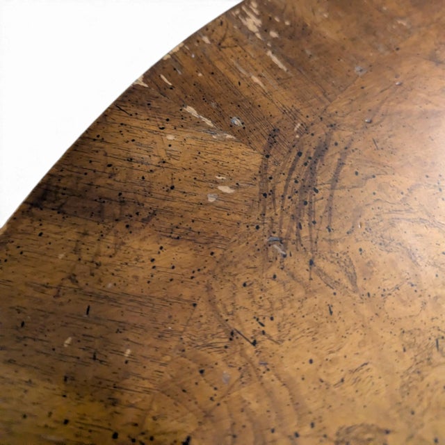 A vintage Louis XV-style oval coffee table with a richly figured wood top, contrasting perimeter band and a flowing...